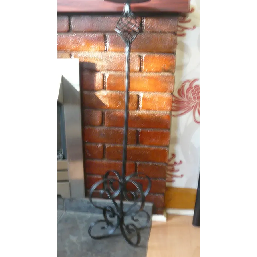 Single scrolled candle stick 35in tall Wimborne wrought iron works