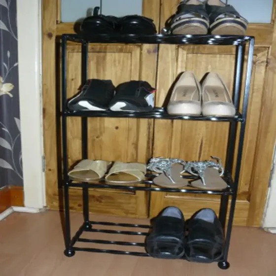 Eight pair wrought iron shoe rack